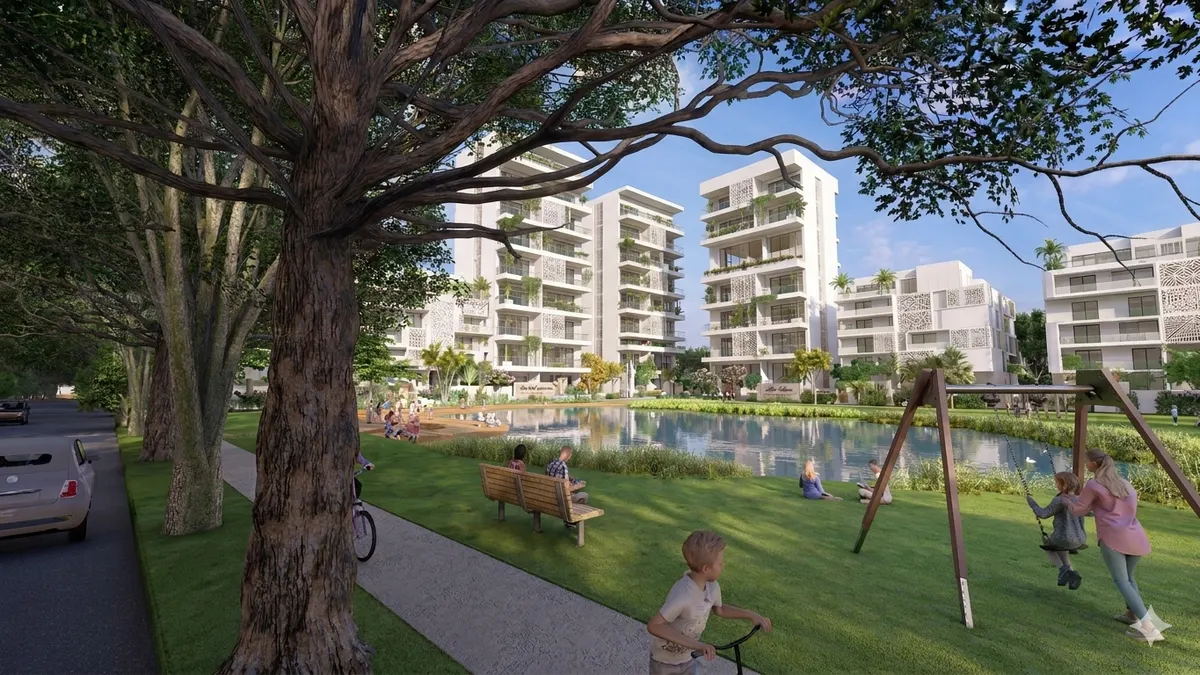 Visualización de un plan residencial en torno a un parque con lago y zonas de juego